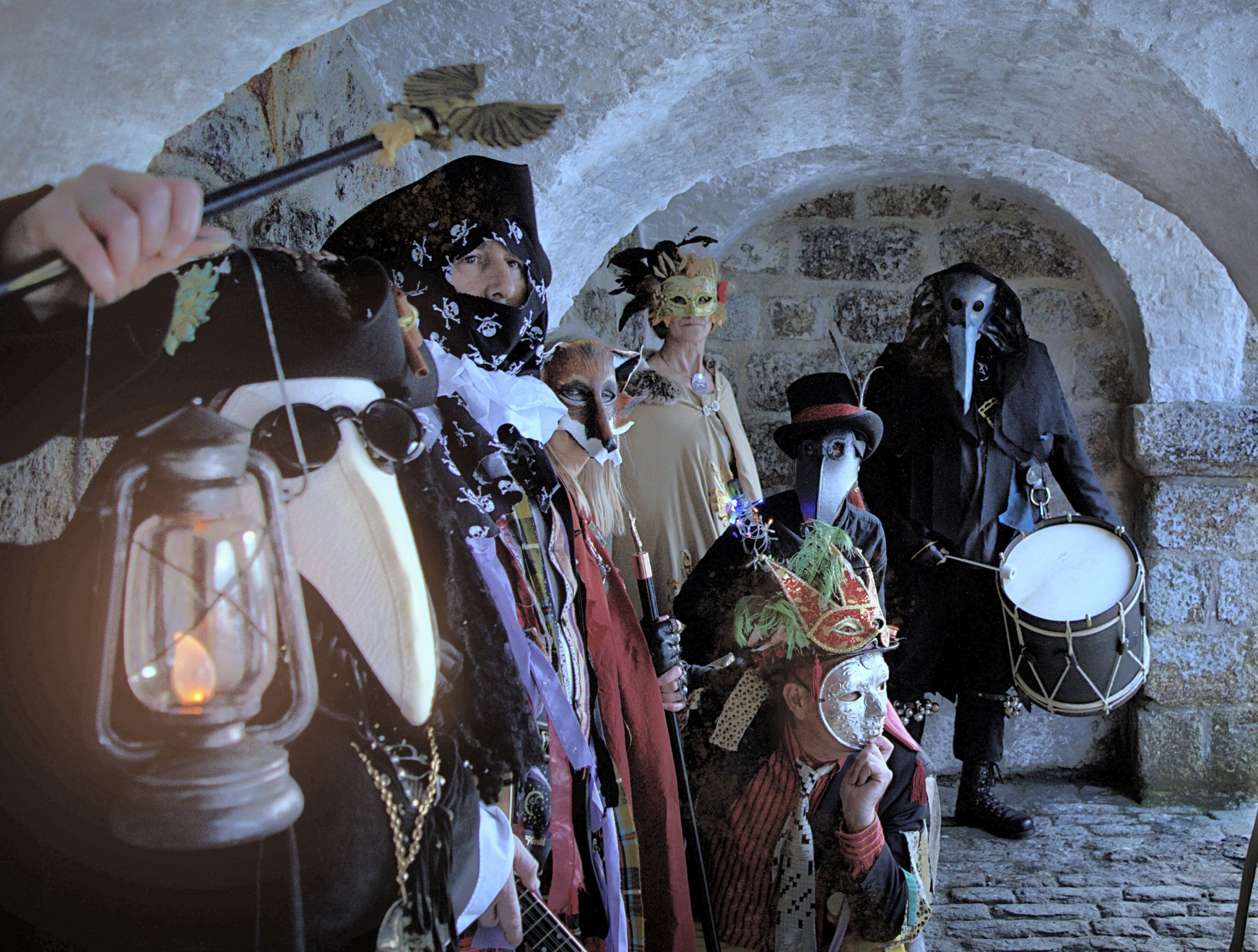 Photo of people dressed in costume in a vaulted room