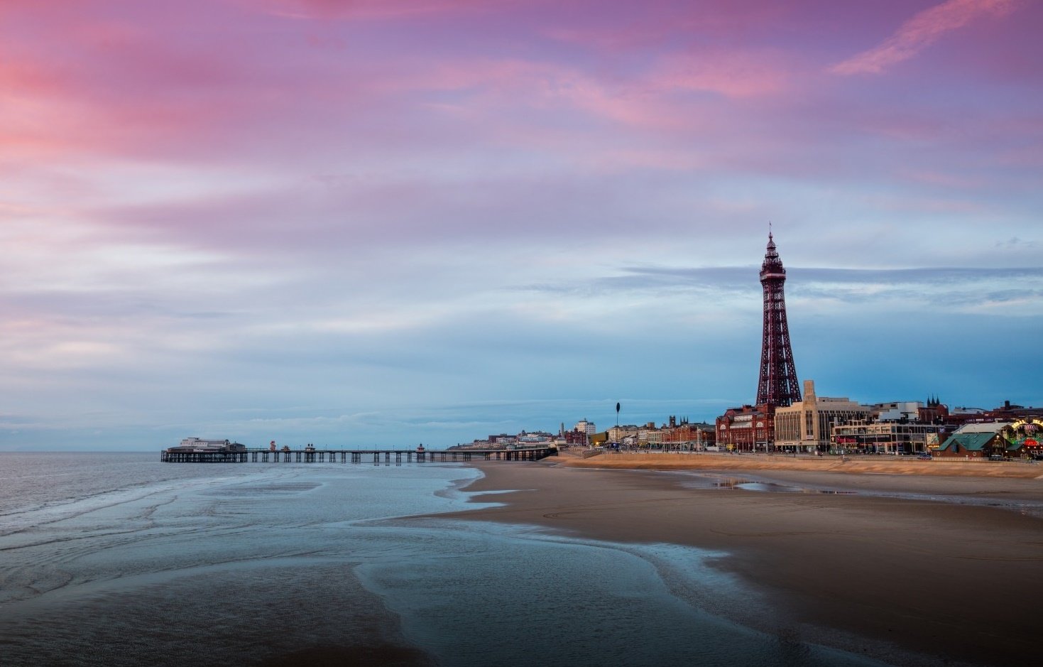 Photo of beach and tower at sunset