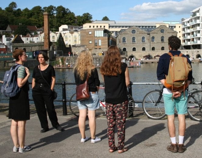 Photo of group looking across a river