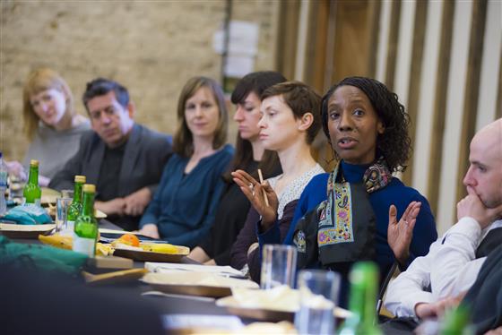 Photo of people in meeting at mealtime