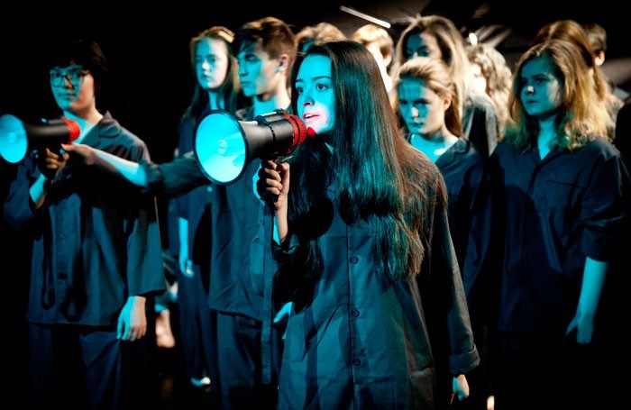 Photo of young people performing with megaphone