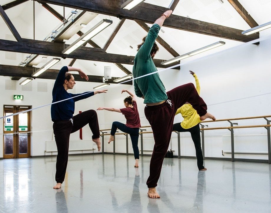 Photo of three dancers in studio