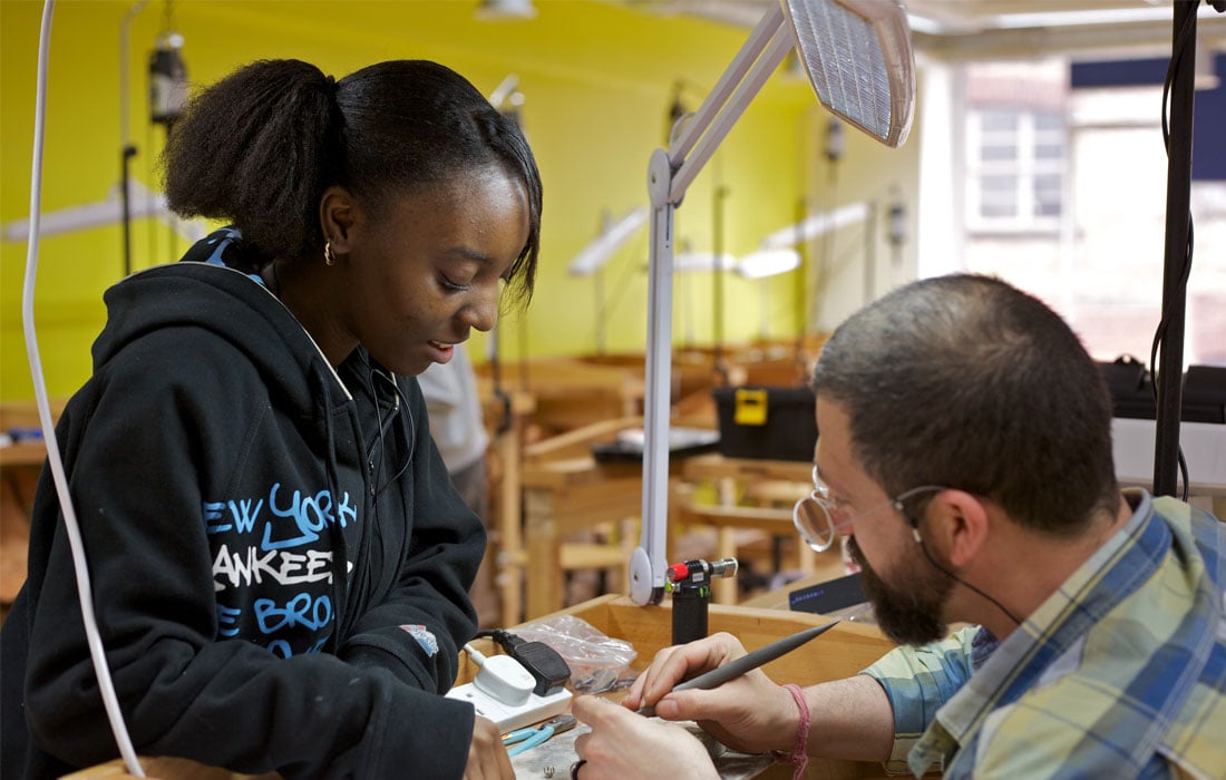 Photo of a girl learning on a craft apprenticeship