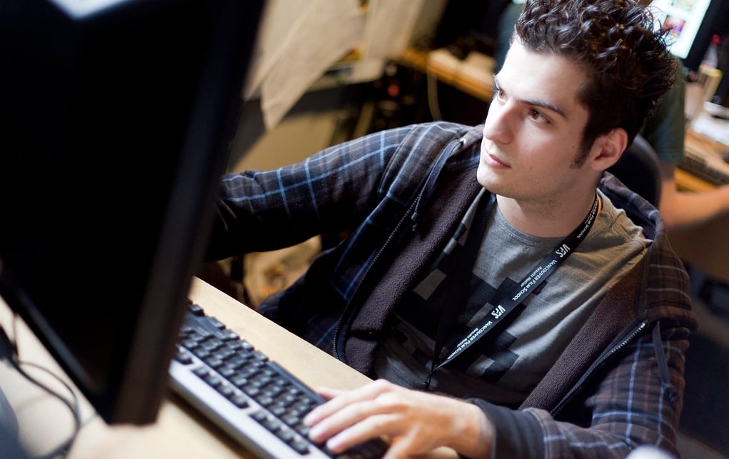 A man sitting at a computer