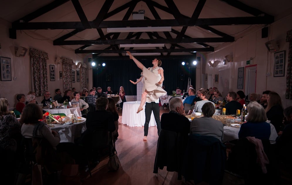 A photo of a dance performance in a hall