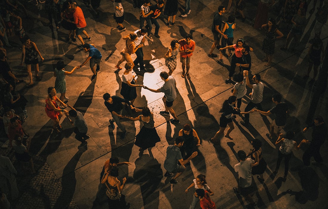 A photo of people dancing on a dancefloor