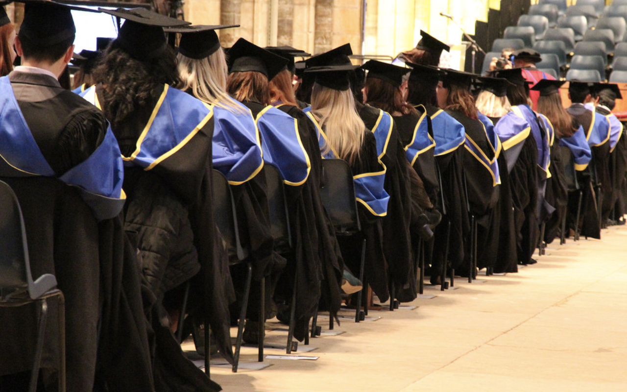 graduates in a line on graduation day