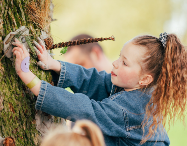 Girl involved with natural art project