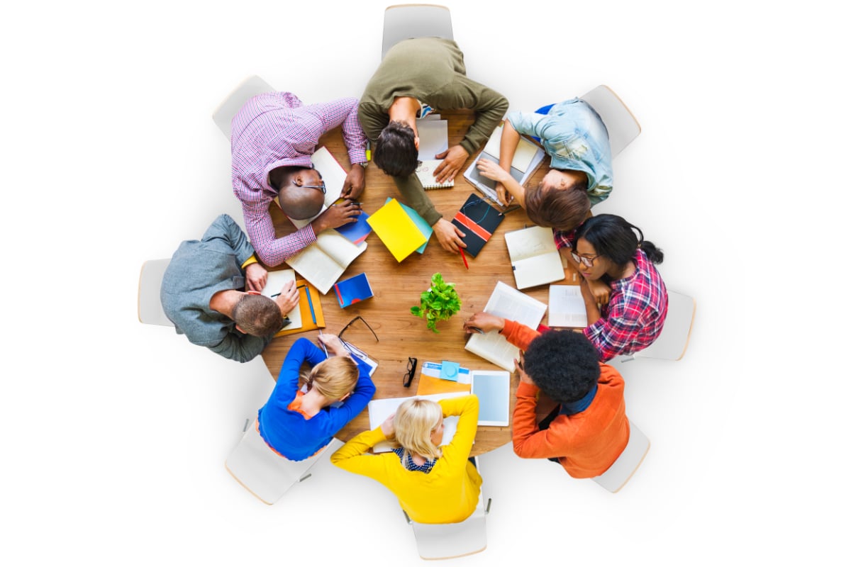 Group of tired students sleeping at table