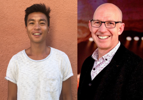 Anthony Lau is an Asian man. He has dark hair + eyebrows and is wearing a white striped t-shirt. He is smiling at the camera, standing against an orange wall. Alexander McGowan is a white man. He is bald, wears black glasses and is wearing a black cardigan with a white patterned shirt underneath. He is stood in a theatre, the background is blurred and he is smiling at the camera.