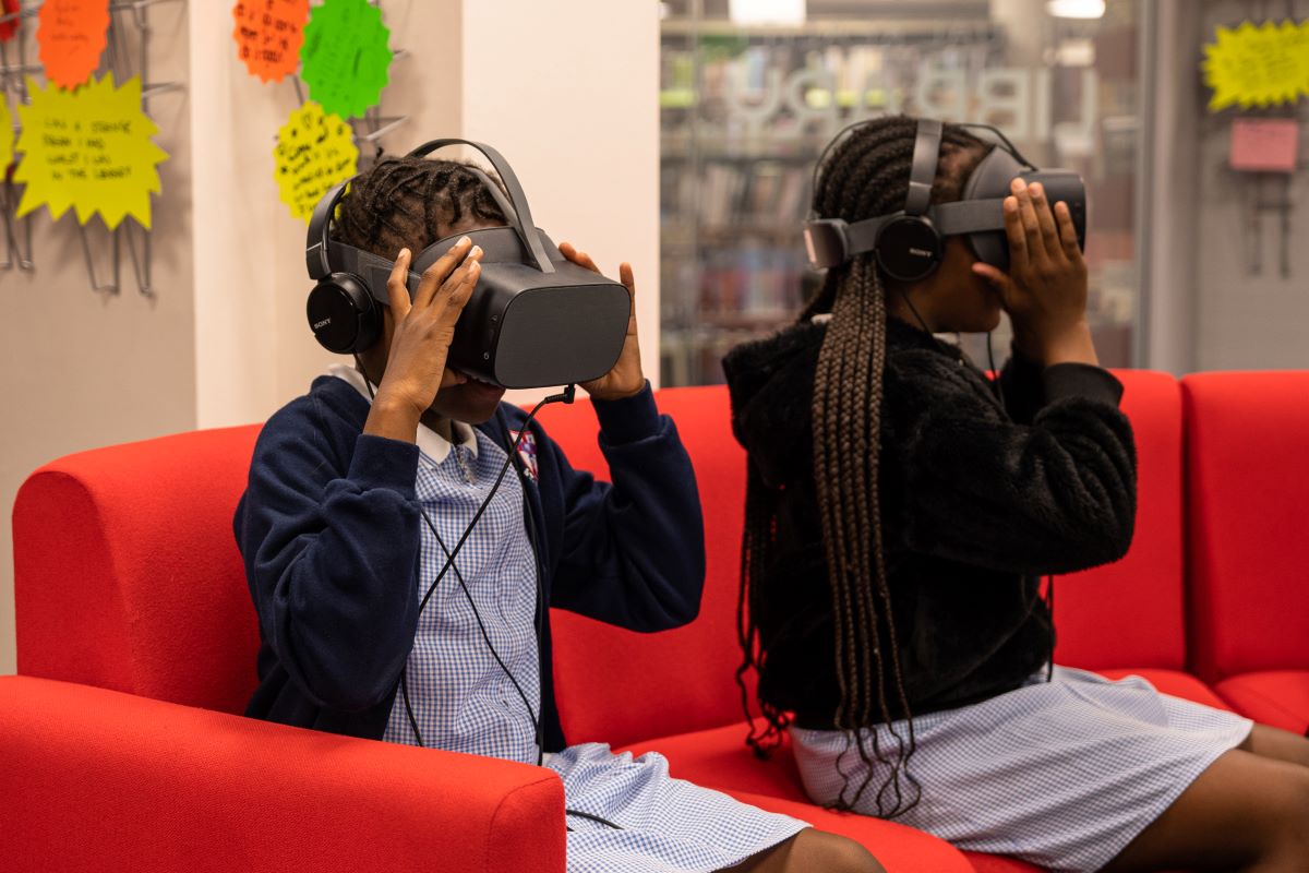 Two schoolchildren using VR