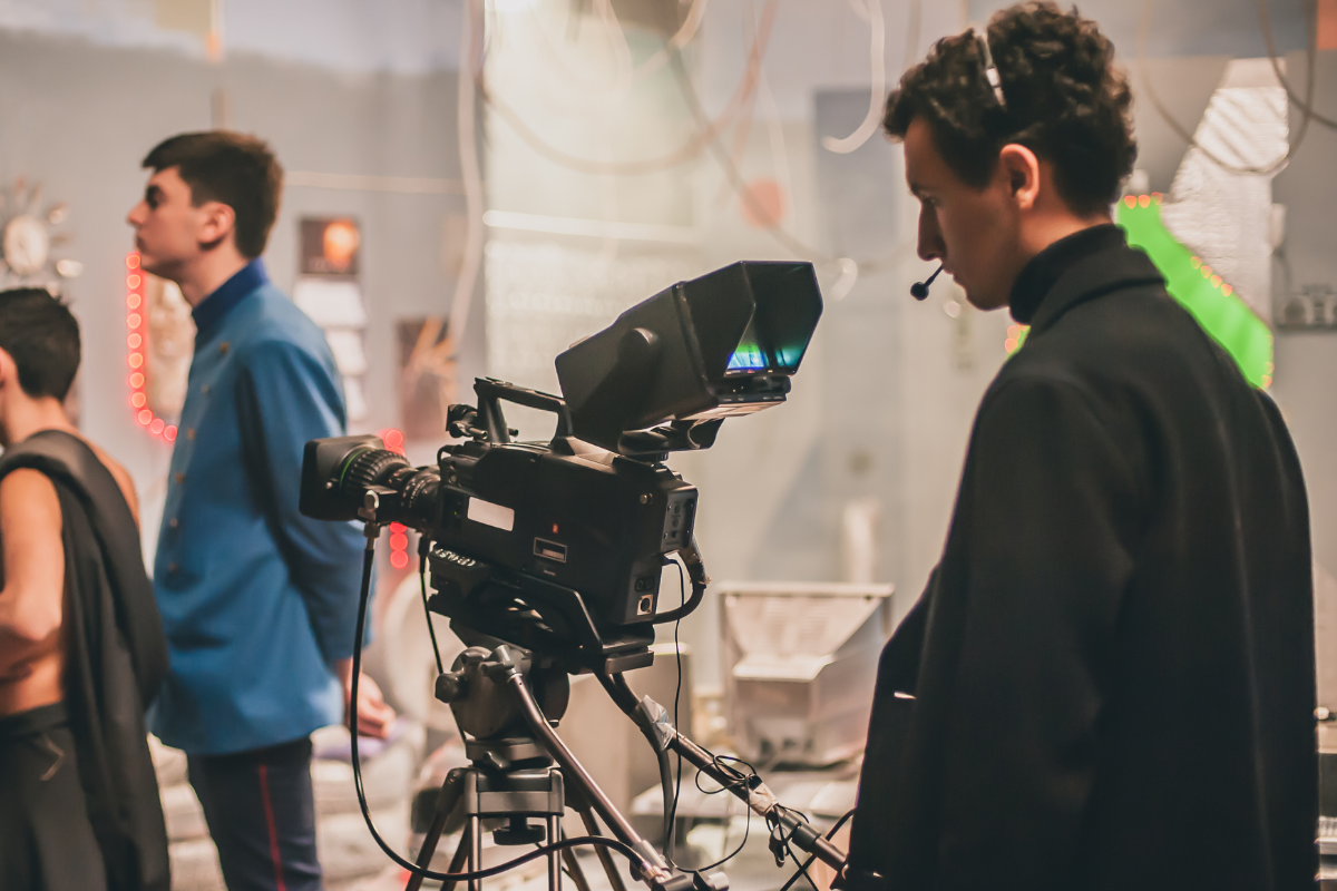 A young producer works on film set