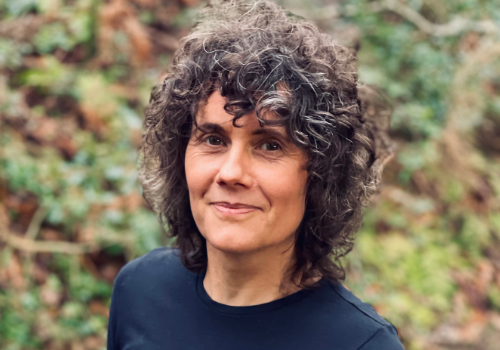 Heather Peak, pictured wearing a T-shirt printed on residency at Artlab Contemporary Print Studio, University of Central Lancashire, titled ‘Autist Hold’. Shot on location in artist's woodland, part of the Celtic Rainforest Wales rewilding program.