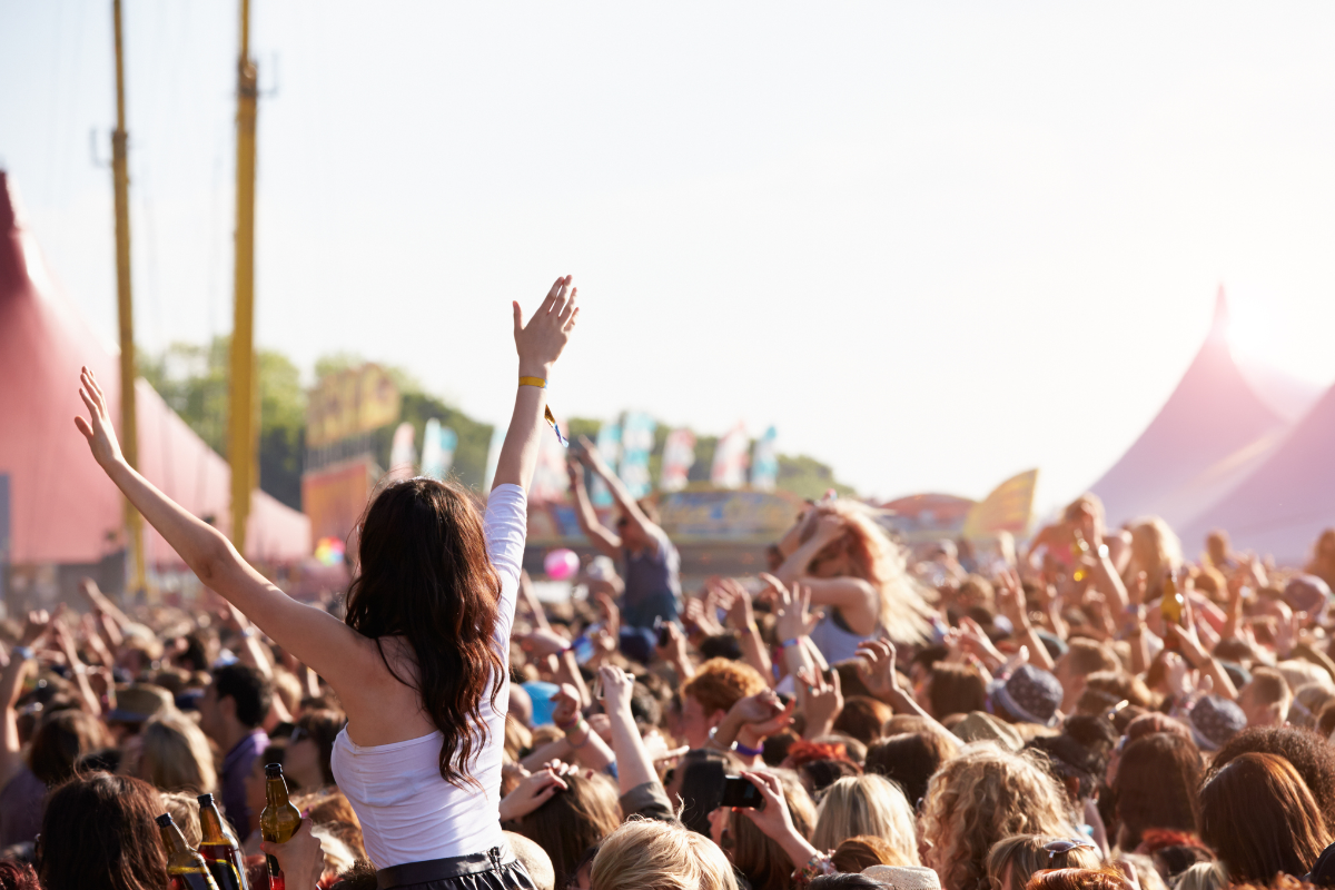 People at an outdoor music festival