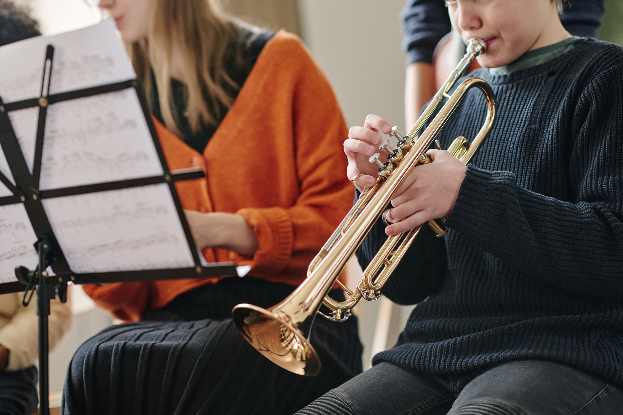 A young trumpet player prepares to play