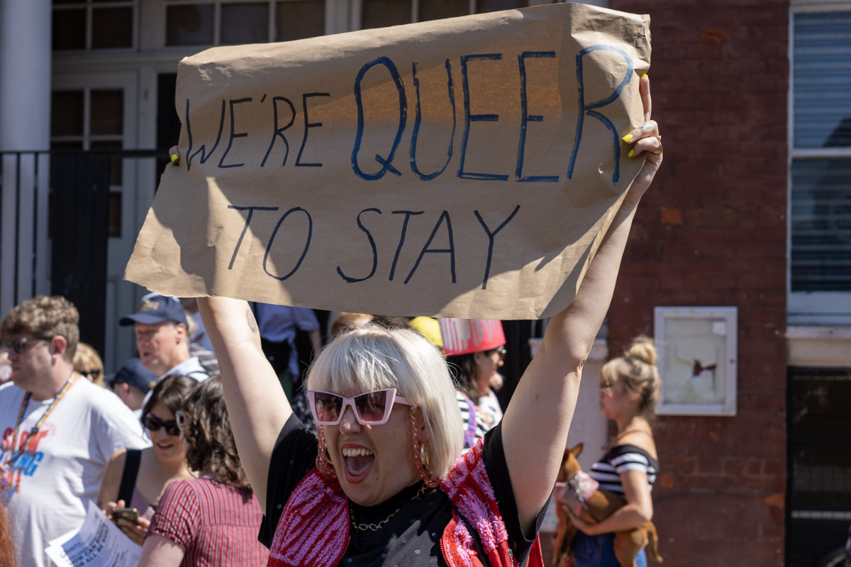 A protester holds up  sign at the rally to save Bethnal Green Working Men’s Club