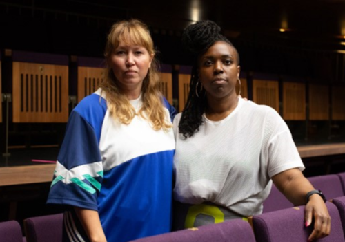 Kate Prince  and Dannielle ‘Rhimes’ Lecointe stand in an auditorium