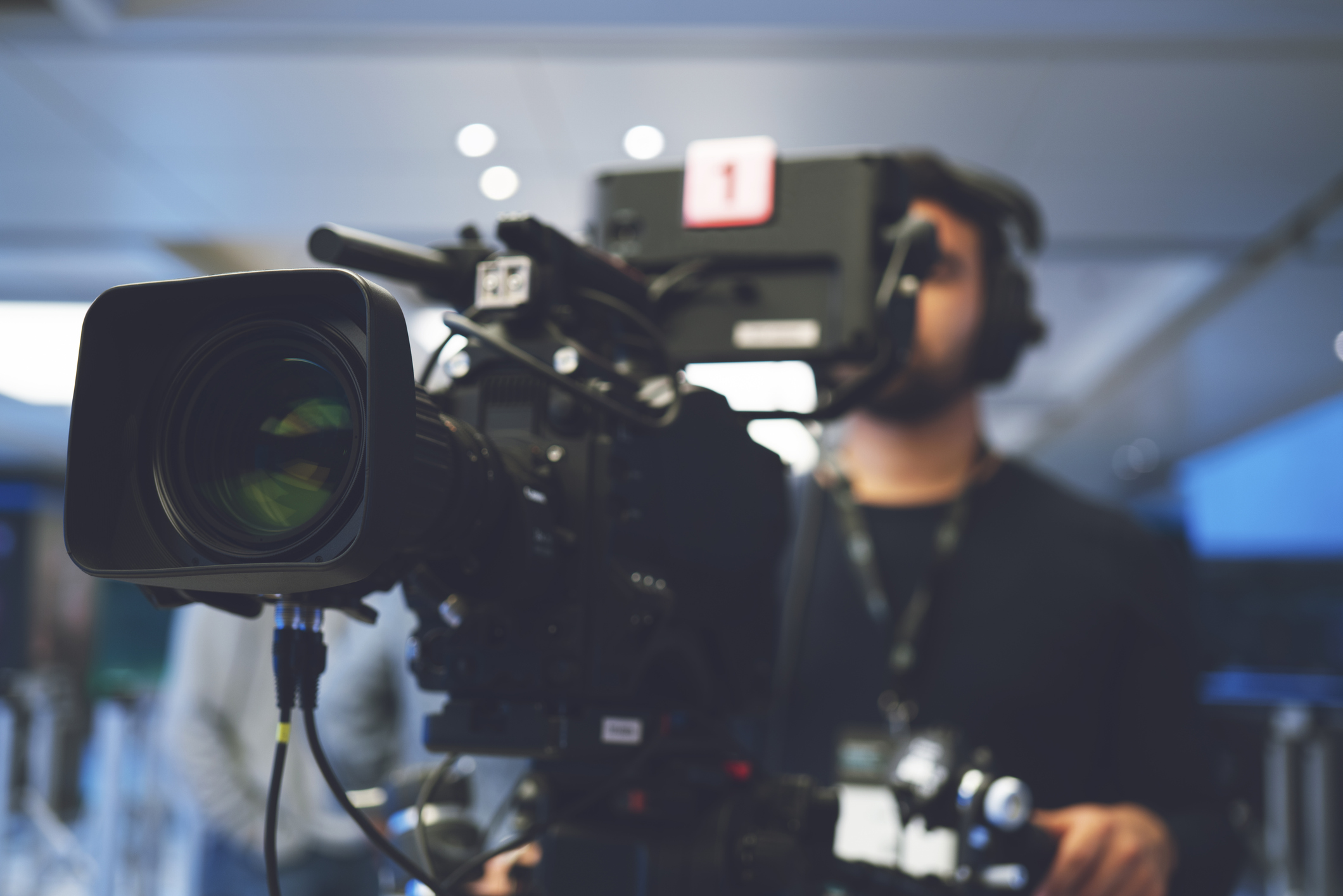 A cameraman working on a TV set